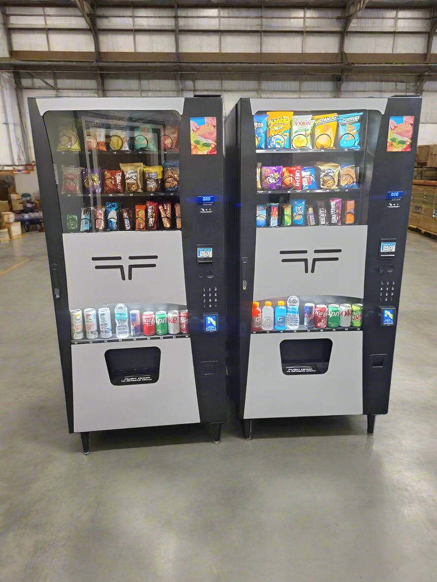 Two vending machines with snacks and drinks on a wooden floor. 